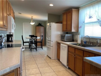 This home truly has it all! 3 bedrooms/2 bath + bonus room on Indianwood Golf and Country Club in Florida - for sale on GolfHomes.com, golf home, golf lot