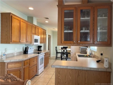 This home truly has it all! 3 bedrooms/2 bath + bonus room on Indianwood Golf and Country Club in Florida - for sale on GolfHomes.com, golf home, golf lot