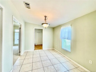 This home truly has it all! 3 bedrooms/2 bath + bonus room on Indianwood Golf and Country Club in Florida - for sale on GolfHomes.com, golf home, golf lot