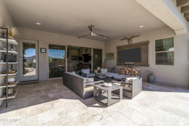 Discover unparalleled luxury in this David Weekley home, located on Verrado Golf Club - Victory in Arizona - for sale on GolfHomes.com, golf home, golf lot