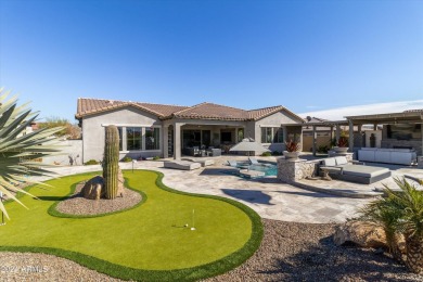 Discover unparalleled luxury in this David Weekley home, located on Verrado Golf Club - Victory in Arizona - for sale on GolfHomes.com, golf home, golf lot