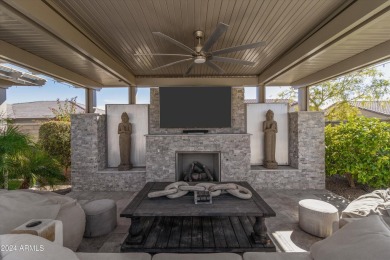 Discover unparalleled luxury in this David Weekley home, located on Verrado Golf Club - Victory in Arizona - for sale on GolfHomes.com, golf home, golf lot