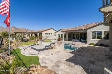 Discover unparalleled luxury in this David Weekley home, located on Verrado Golf Club - Victory in Arizona - for sale on GolfHomes.com, golf home, golf lot