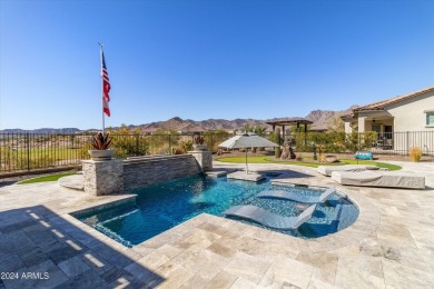 Discover unparalleled luxury in this David Weekley home, located on Verrado Golf Club - Victory in Arizona - for sale on GolfHomes.com, golf home, golf lot