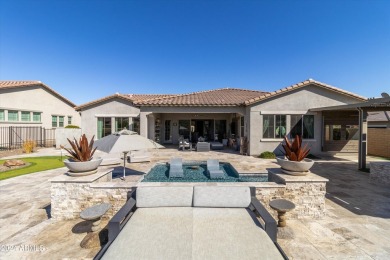 Discover unparalleled luxury in this David Weekley home, located on Verrado Golf Club - Victory in Arizona - for sale on GolfHomes.com, golf home, golf lot