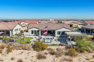 Discover unparalleled luxury in this David Weekley home, located on Verrado Golf Club - Victory in Arizona - for sale on GolfHomes.com, golf home, golf lot