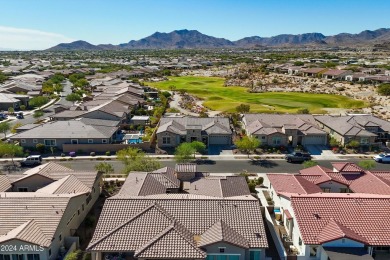 Discover unparalleled luxury in this David Weekley home, located on Verrado Golf Club - Victory in Arizona - for sale on GolfHomes.com, golf home, golf lot