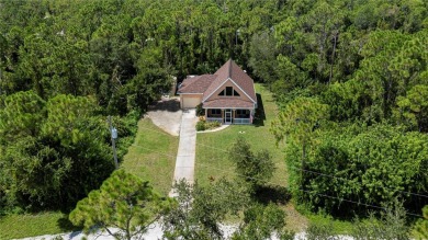 CUSTOM A-FRAME*LAKEFRONT HOME* | 3 Beds | 2 Baths | 1.5-Car on Seminole Lakes Country Club in Florida - for sale on GolfHomes.com, golf home, golf lot