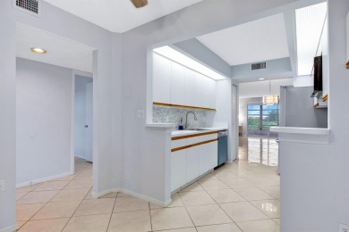 This top-floor condo is situated in Wynmoor's golf community and on Wynmoor Golf Course in Florida - for sale on GolfHomes.com, golf home, golf lot