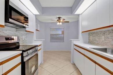 This top-floor condo is situated in Wynmoor's golf community and on Wynmoor Golf Course in Florida - for sale on GolfHomes.com, golf home, golf lot