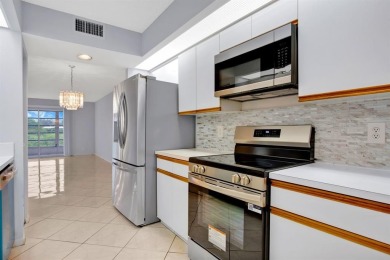 This top-floor condo is situated in Wynmoor's golf community and on Wynmoor Golf Course in Florida - for sale on GolfHomes.com, golf home, golf lot