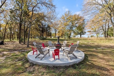 Stunning 2023 custom one-story home on a beautifully treed on Cedar Creek Country Club in Texas - for sale on GolfHomes.com, golf home, golf lot