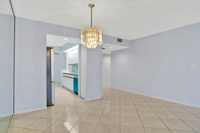 This top-floor condo is situated in Wynmoor's golf community and on Wynmoor Golf Course in Florida - for sale on GolfHomes.com, golf home, golf lot