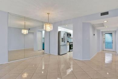 This top-floor condo is situated in Wynmoor's golf community and on Wynmoor Golf Course in Florida - for sale on GolfHomes.com, golf home, golf lot
