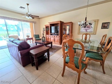 This beautifully maintained south-facing attached villa is on Fiddlesticks Country Club in Florida - for sale on GolfHomes.com, golf home, golf lot