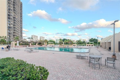 Updated 2/2 with serene golf course and water views in the heart on Turnberry Isle Resort and Club in Florida - for sale on GolfHomes.com, golf home, golf lot