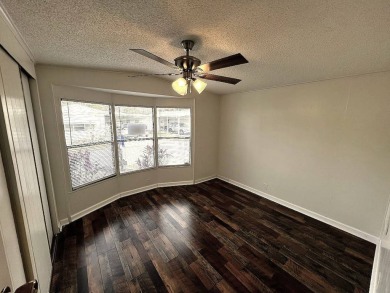 A charming home in the desirable Hidden Golf Community. Welcome on Lake Henry Golf Club in Florida - for sale on GolfHomes.com, golf home, golf lot