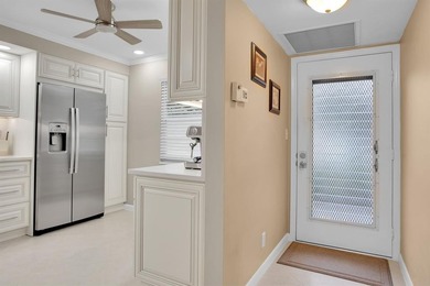 Discover unparalleled elegance and functionality in this on Wynmoor Golf Course in Florida - for sale on GolfHomes.com, golf home, golf lot