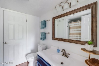 Experience comfort and style in this beautifully updated on Diamondhead Country Club in Mississippi - for sale on GolfHomes.com, golf home, golf lot