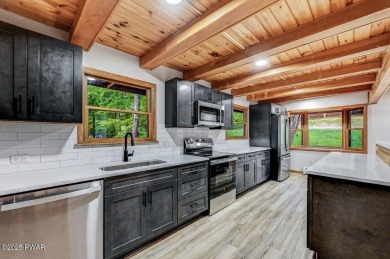 Situated on the golf course in Tanglwood Lakes, this stunning on Paupack Hills Golf and Country Club in Pennsylvania - for sale on GolfHomes.com, golf home, golf lot