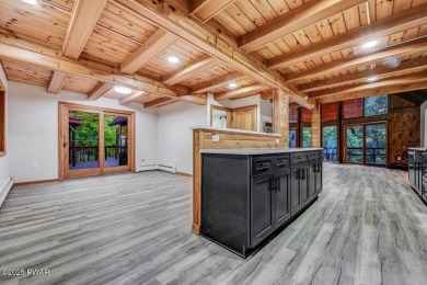 Situated on the golf course in Tanglwood Lakes, this stunning on Paupack Hills Golf and Country Club in Pennsylvania - for sale on GolfHomes.com, golf home, golf lot