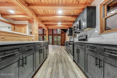 Situated on the golf course in Tanglwood Lakes, this stunning on Paupack Hills Golf and Country Club in Pennsylvania - for sale on GolfHomes.com, golf home, golf lot