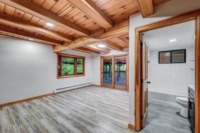 Situated on the golf course in Tanglwood Lakes, this stunning on Paupack Hills Golf and Country Club in Pennsylvania - for sale on GolfHomes.com, golf home, golf lot