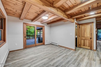 Situated on the golf course in Tanglwood Lakes, this stunning on Paupack Hills Golf and Country Club in Pennsylvania - for sale on GolfHomes.com, golf home, golf lot