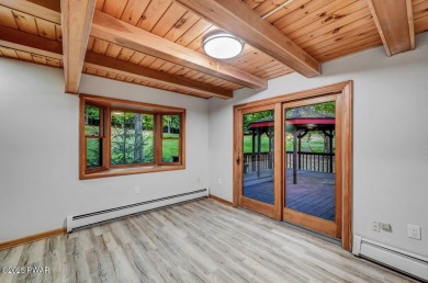 Situated on the golf course in Tanglwood Lakes, this stunning on Paupack Hills Golf and Country Club in Pennsylvania - for sale on GolfHomes.com, golf home, golf lot