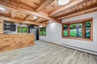 Situated on the golf course in Tanglwood Lakes, this stunning on Paupack Hills Golf and Country Club in Pennsylvania - for sale on GolfHomes.com, golf home, golf lot