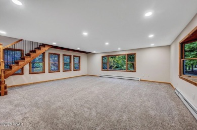Situated on the golf course in Tanglwood Lakes, this stunning on Paupack Hills Golf and Country Club in Pennsylvania - for sale on GolfHomes.com, golf home, golf lot