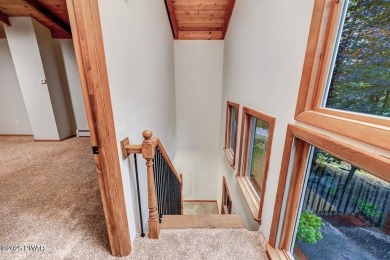 Situated on the golf course in Tanglwood Lakes, this stunning on Paupack Hills Golf and Country Club in Pennsylvania - for sale on GolfHomes.com, golf home, golf lot