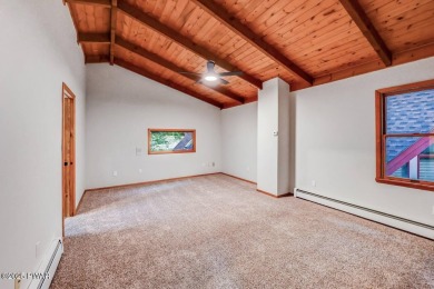 Situated on the golf course in Tanglwood Lakes, this stunning on Paupack Hills Golf and Country Club in Pennsylvania - for sale on GolfHomes.com, golf home, golf lot