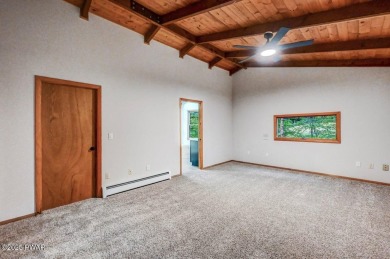 Situated on the golf course in Tanglwood Lakes, this stunning on Paupack Hills Golf and Country Club in Pennsylvania - for sale on GolfHomes.com, golf home, golf lot