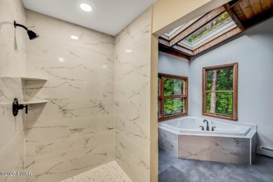 Situated on the golf course in Tanglwood Lakes, this stunning on Paupack Hills Golf and Country Club in Pennsylvania - for sale on GolfHomes.com, golf home, golf lot