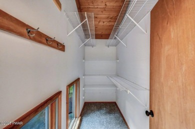 Situated on the golf course in Tanglwood Lakes, this stunning on Paupack Hills Golf and Country Club in Pennsylvania - for sale on GolfHomes.com, golf home, golf lot