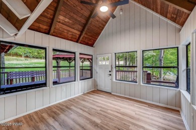 Situated on the golf course in Tanglwood Lakes, this stunning on Paupack Hills Golf and Country Club in Pennsylvania - for sale on GolfHomes.com, golf home, golf lot