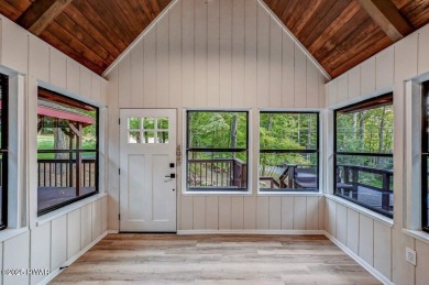 Situated on the golf course in Tanglwood Lakes, this stunning on Paupack Hills Golf and Country Club in Pennsylvania - for sale on GolfHomes.com, golf home, golf lot