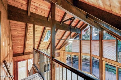 Situated on the golf course in Tanglwood Lakes, this stunning on Paupack Hills Golf and Country Club in Pennsylvania - for sale on GolfHomes.com, golf home, golf lot