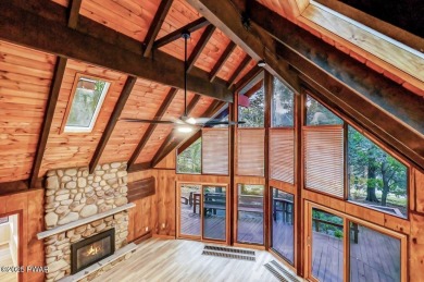 Situated on the golf course in Tanglwood Lakes, this stunning on Paupack Hills Golf and Country Club in Pennsylvania - for sale on GolfHomes.com, golf home, golf lot