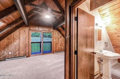 Situated on the golf course in Tanglwood Lakes, this stunning on Paupack Hills Golf and Country Club in Pennsylvania - for sale on GolfHomes.com, golf home, golf lot