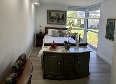 BEAUTIFUL CORNER UNIT WITH EAST EXPOSURE, LAKE, GOLF COURSE, AND on The Country Club At Boca Raton in Florida - for sale on GolfHomes.com, golf home, golf lot