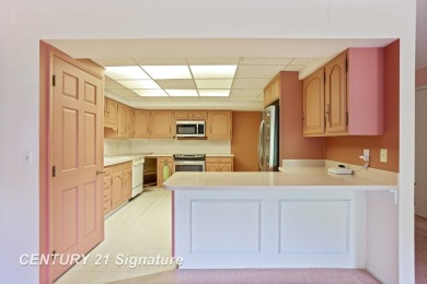 This top floor condo is located next to The Saginaw Country Club on Saginaw Country Club in Michigan - for sale on GolfHomes.com, golf home, golf lot