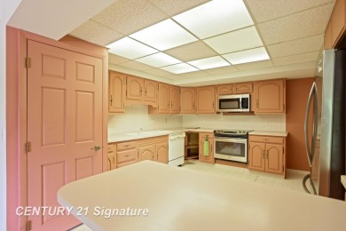 This top floor condo is located next to The Saginaw Country Club on Saginaw Country Club in Michigan - for sale on GolfHomes.com, golf home, golf lot