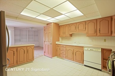 This top floor condo is located next to The Saginaw Country Club on Saginaw Country Club in Michigan - for sale on GolfHomes.com, golf home, golf lot