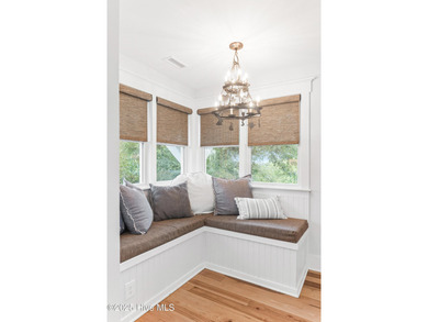 Coastal charm on one of the island's most iconic corners. At the on Bald Head Island Golf Club in North Carolina - for sale on GolfHomes.com, golf home, golf lot