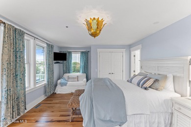 Coastal charm on one of the island's most iconic corners. At the on Bald Head Island Golf Club in North Carolina - for sale on GolfHomes.com, golf home, golf lot