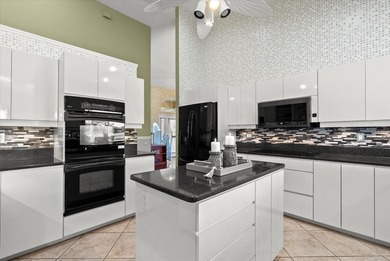 This elegant 3-bedroom, 2.5-bath home with an oversized 2.5-car on Waterford Golf Club in Florida - for sale on GolfHomes.com, golf home, golf lot