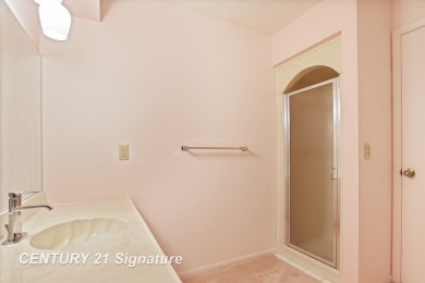 This top floor condo is located next to The Saginaw Country Club on Saginaw Country Club in Michigan - for sale on GolfHomes.com, golf home, golf lot