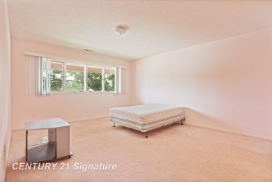 This top floor condo is located next to The Saginaw Country Club on Saginaw Country Club in Michigan - for sale on GolfHomes.com, golf home, golf lot